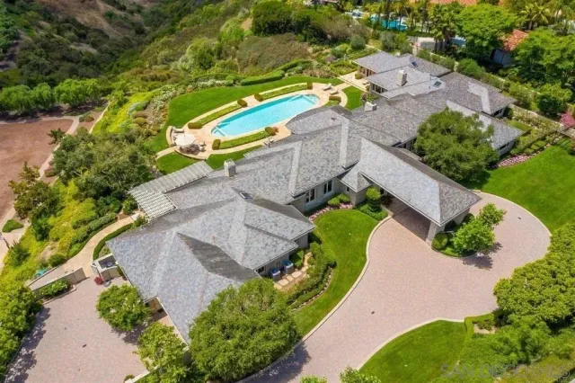 an aerial view of a house with a garden