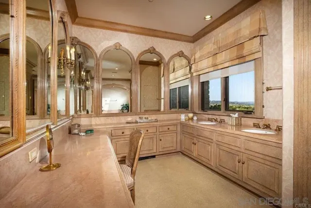 a large bathroom with a large tub and sink