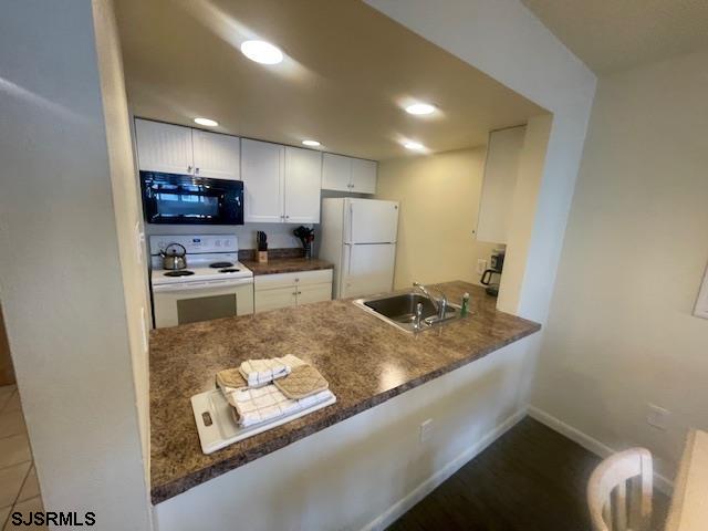 4500 West Brigantine Avenue, Unit 2322 Brigantine, NJ 08203 - Photo 3 of 16 a kitchen with stainless steel appliances granite countertop a sink refrigerator and cabinets