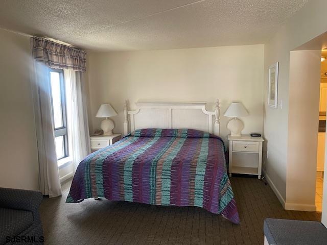 4500 West Brigantine Avenue, Unit 2322 Brigantine, NJ 08203 - Photo 10 of 16 a bedroom with a bed and a window