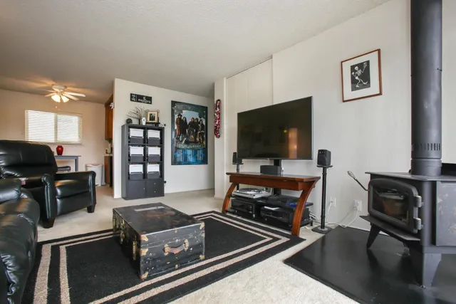 a kitchen with stainless steel appliances a stove a sink and a microwave