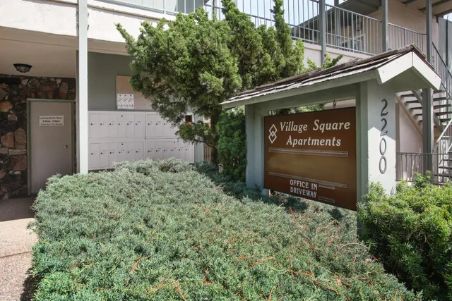 a backyard of a house with outdoor seating