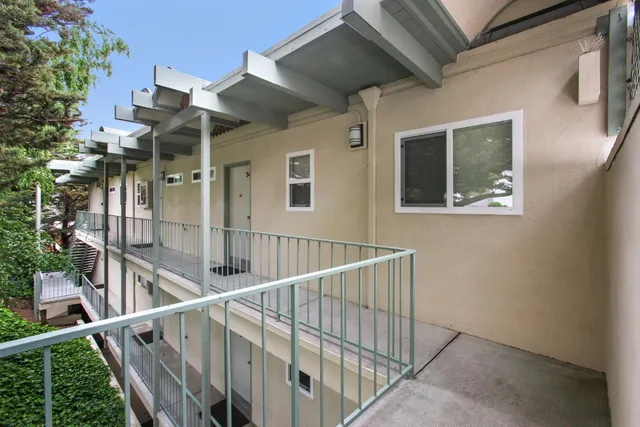 a view of a balcony with chairs