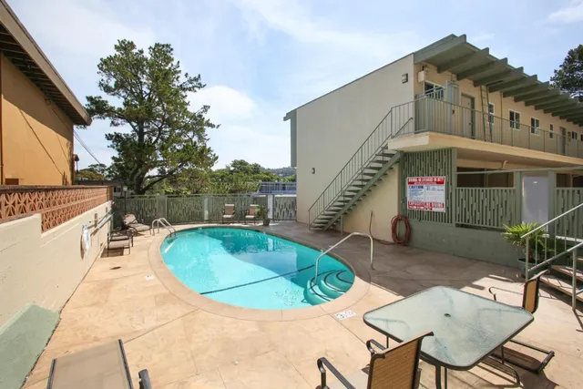 a view of a hallway with wooden shelves