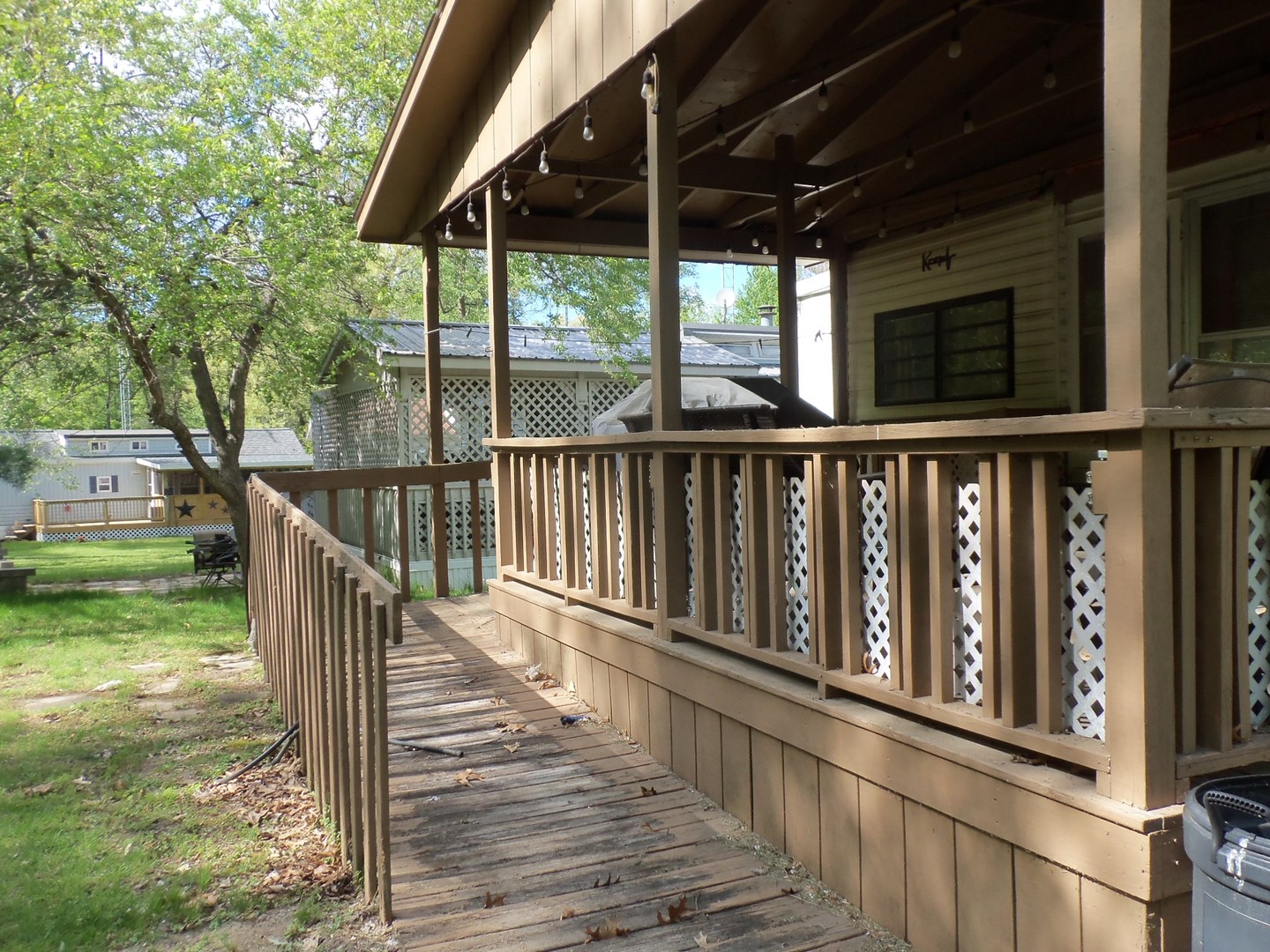 21-216 Woodhaven Sublette, IL 61367 - Photo 5 of 23 a view of a balcony with wooden floor