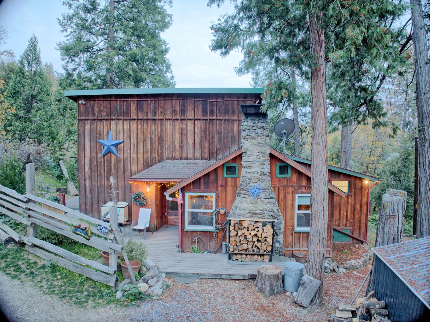 a view of a wooden deck and a backyard