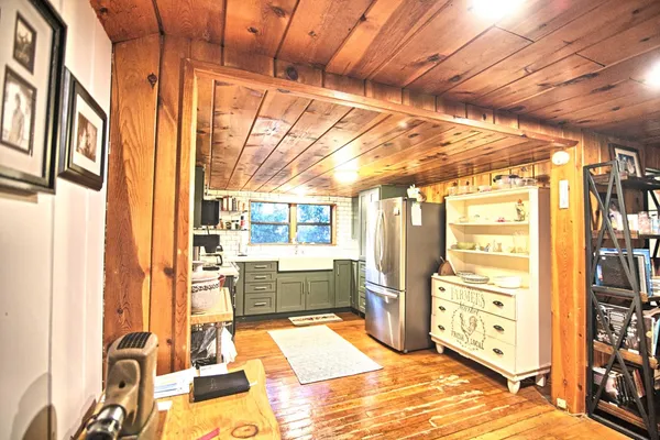 a room with multiple furniture and a window