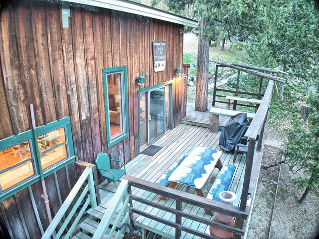 a view of outdoor space with seating area and trees
