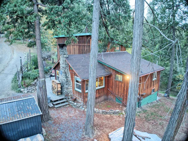 a view of backyard with green space and deck