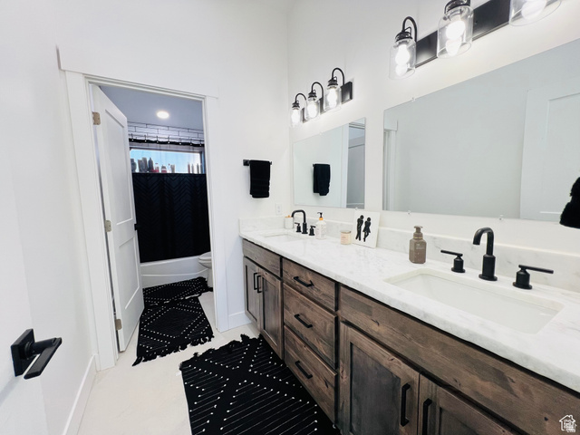 100 Whit Lane Georgetown, ID 83239 - Photo 45 of 76 Bathroom with double vanity and shower / bath combination with curtain