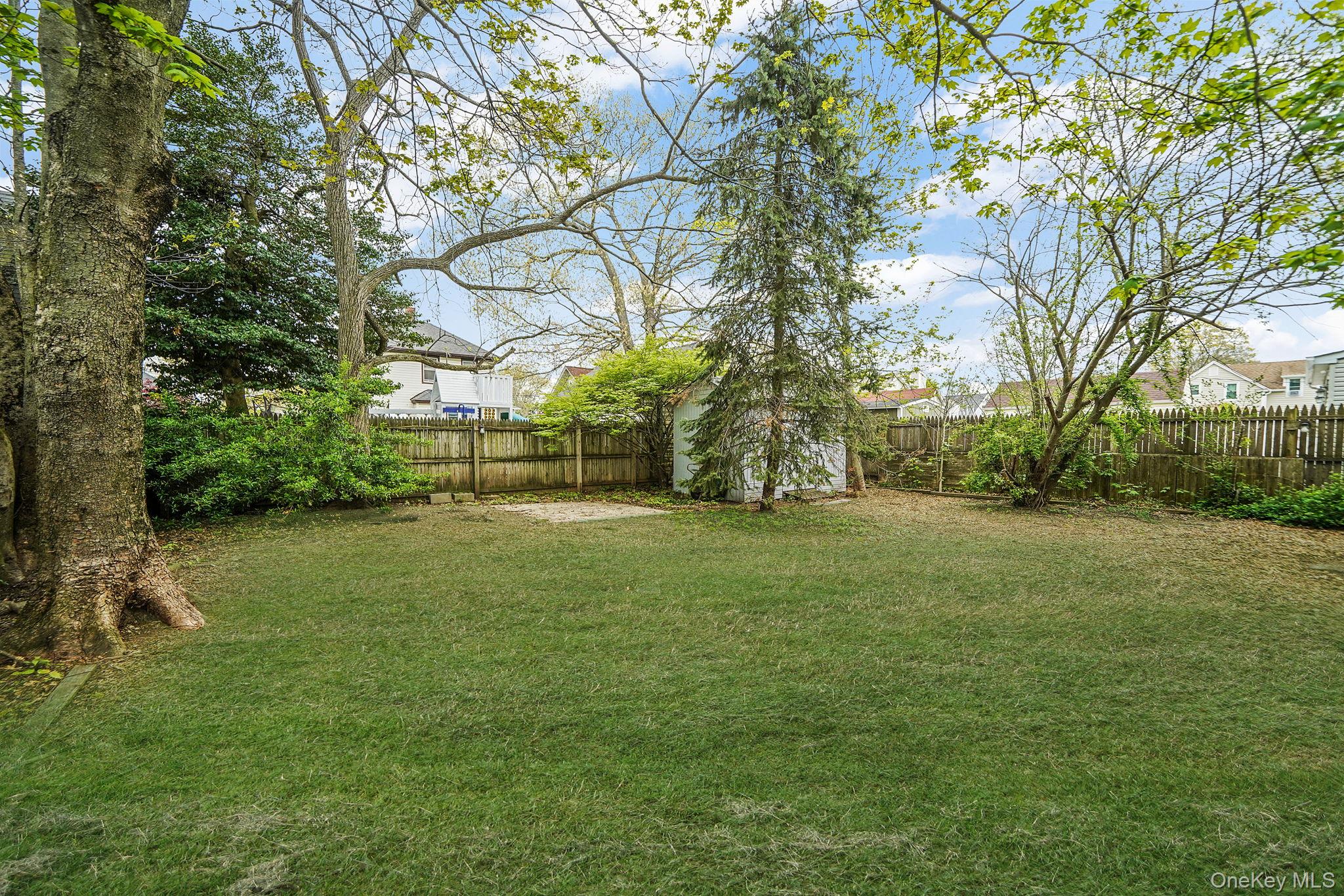 44 Redmond Avenue Bay Shore, NY 11706 - Photo 5 of 20 Rear Yard angle --Grass Added to show potential
