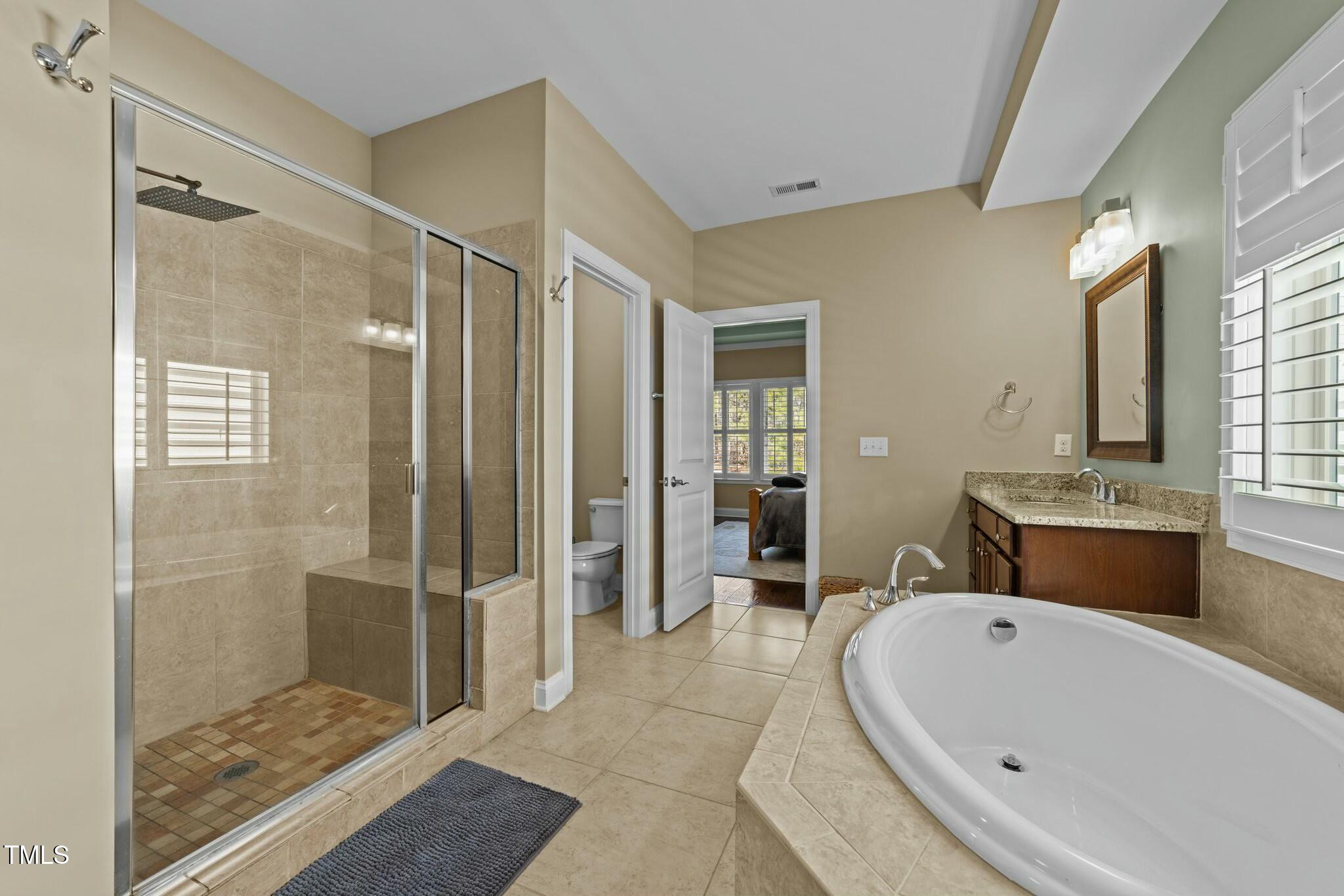 4033 Periwinkle Blue Lane Raleigh, NC 27612 - Photo 17 of 34 Primary Bath
