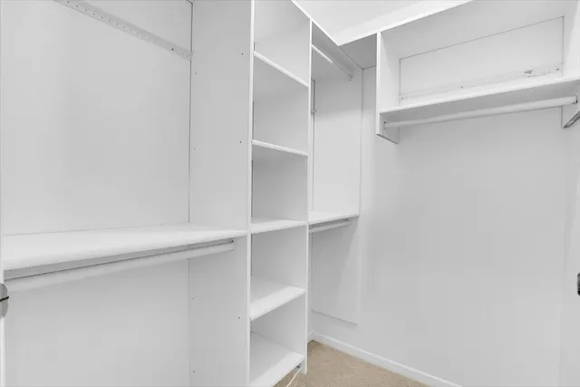 a view of an empty walk in closet
