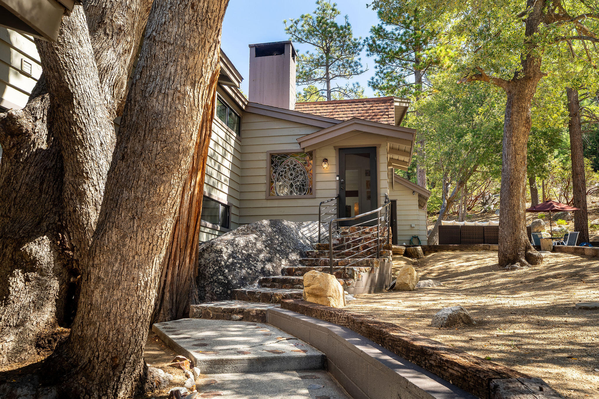 55599 Encino Road Idyllwild, CA 92549 - Photo 16 of 66 a view of a house with a tree in front
