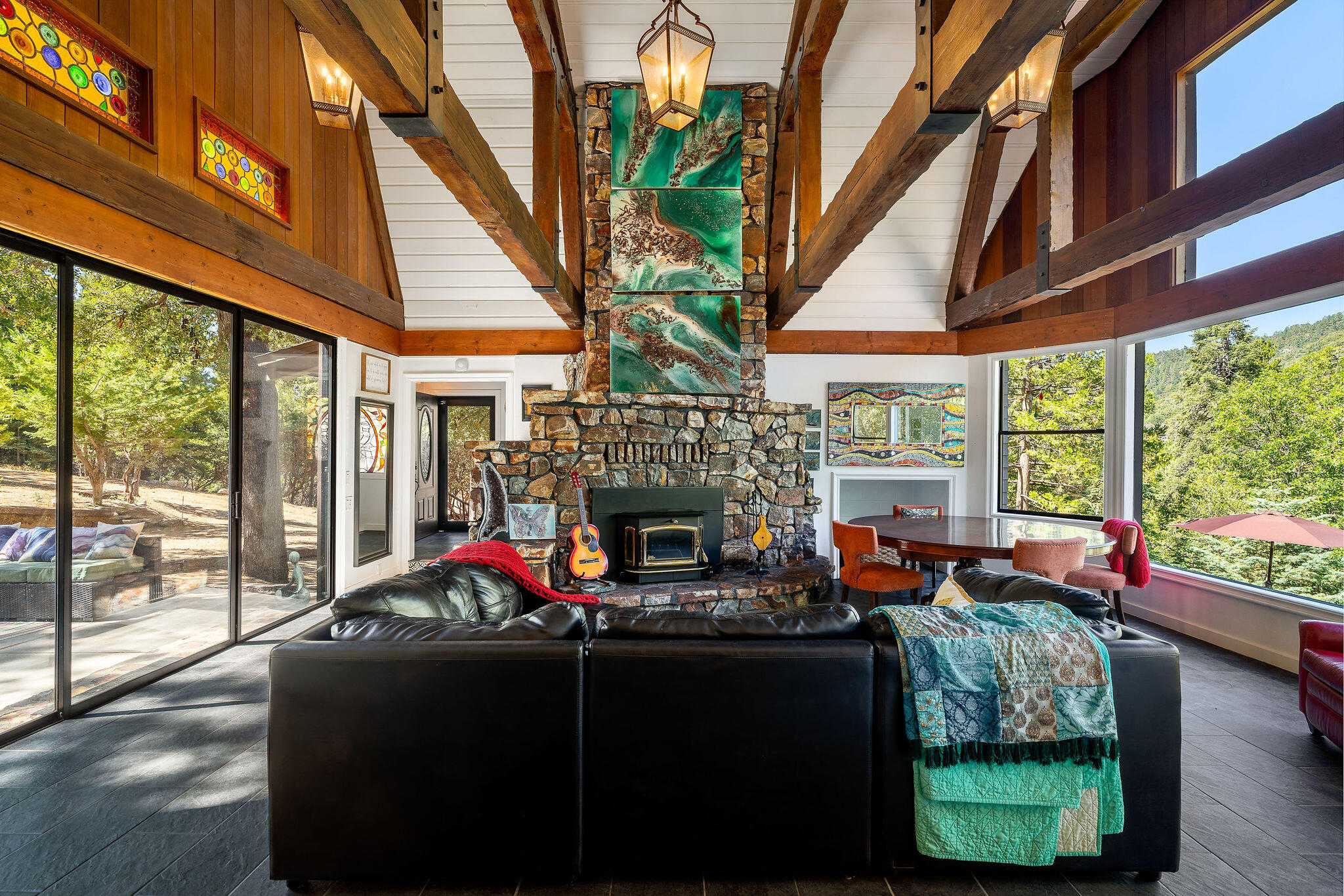 55599 Encino Road Idyllwild, CA 92549 - Photo 23 of 66 a living room filled with furniture and a fireplace