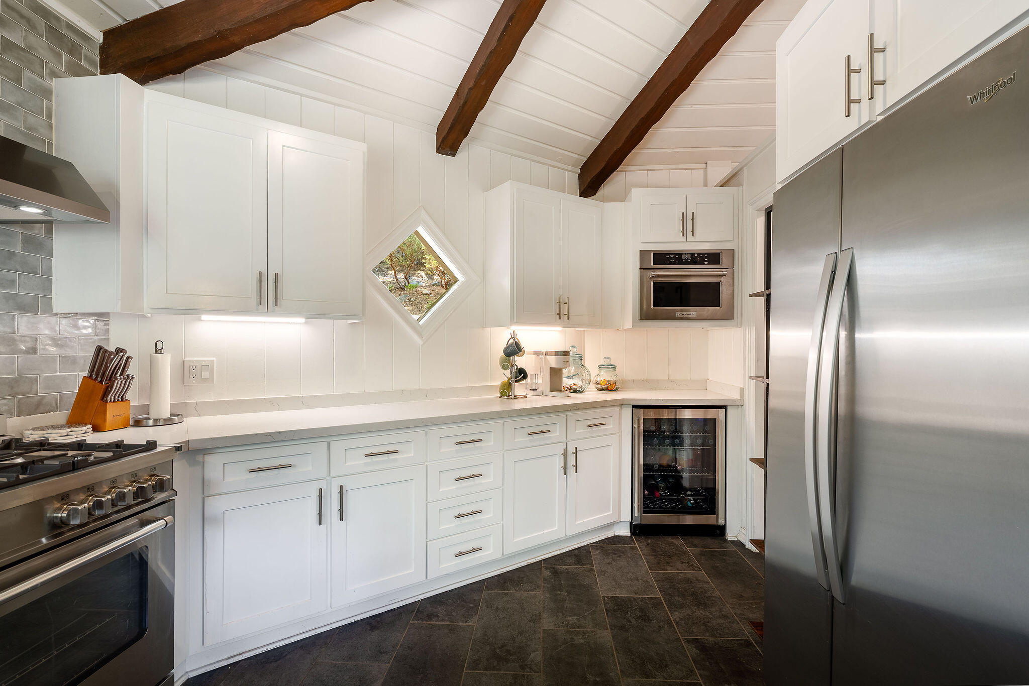 55599 Encino Road Idyllwild, CA 92549 - Photo 29 of 66 a kitchen with cabinets stainless steel appliances and sink