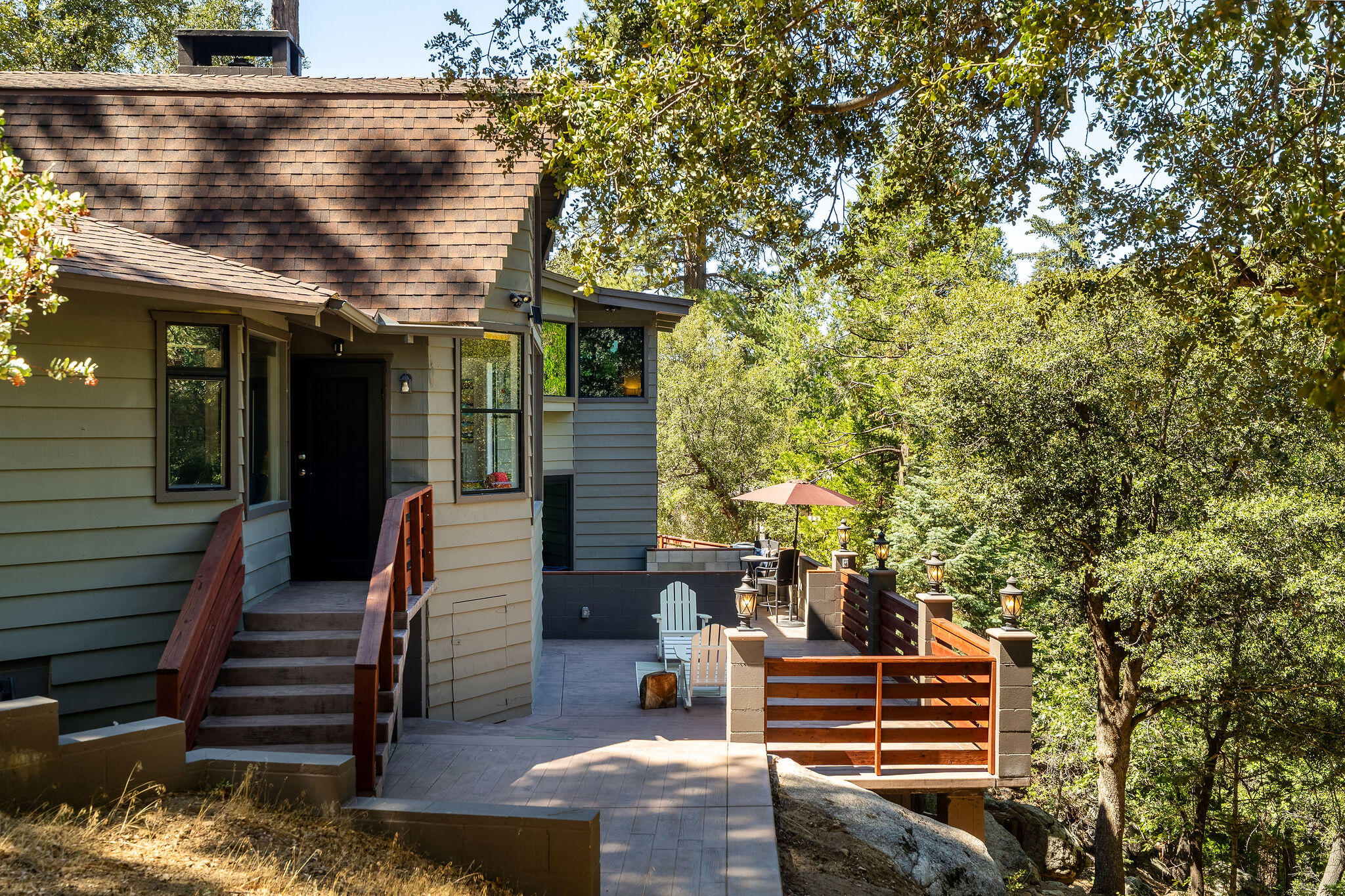 55599 Encino Road Idyllwild, CA 92549 - Photo 3 of 66 a front view of a house with a yard