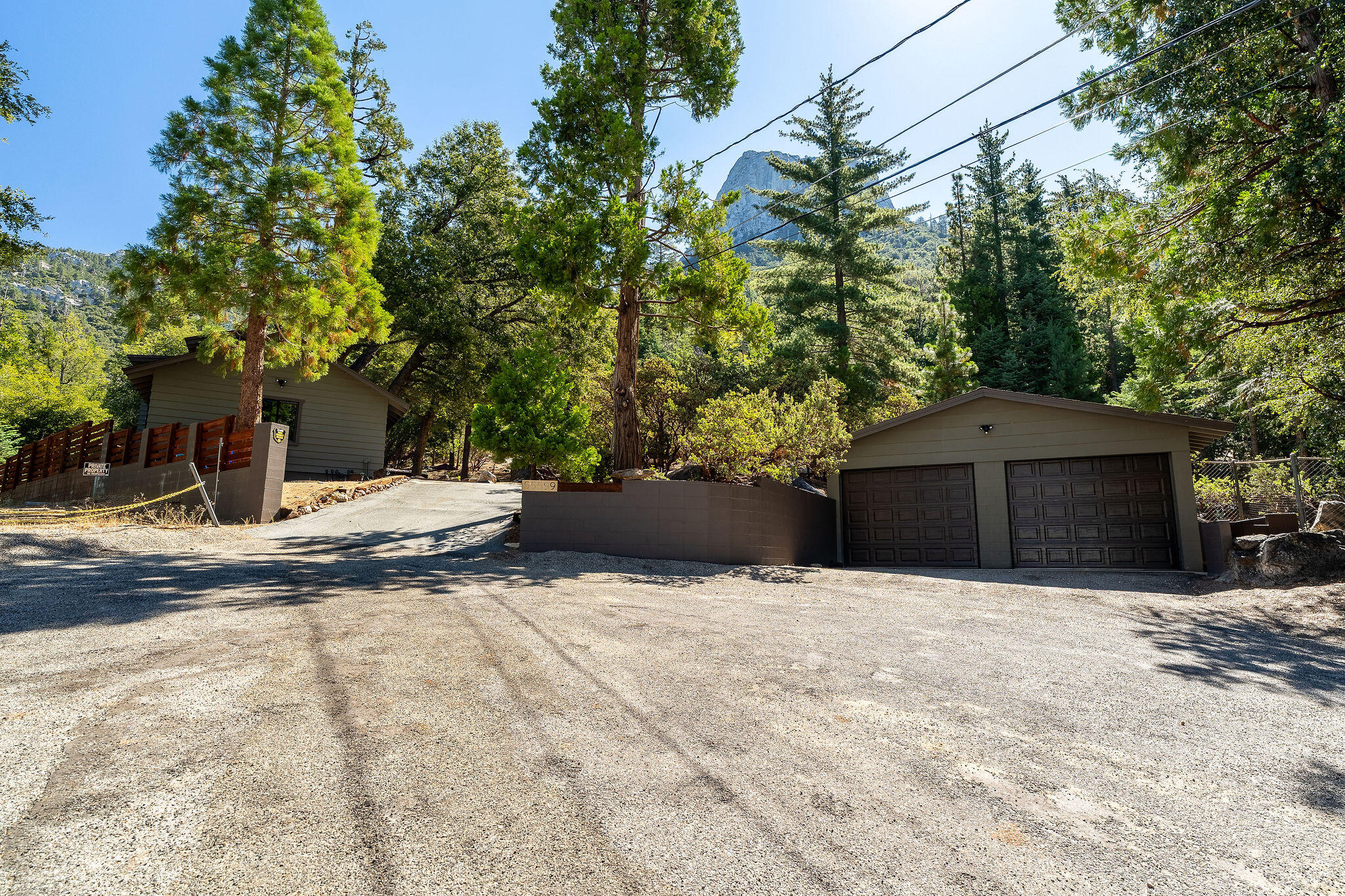 55599 Encino Road Idyllwild, CA 92549 - Photo 4 of 66 a view of the house with a yard and large tree