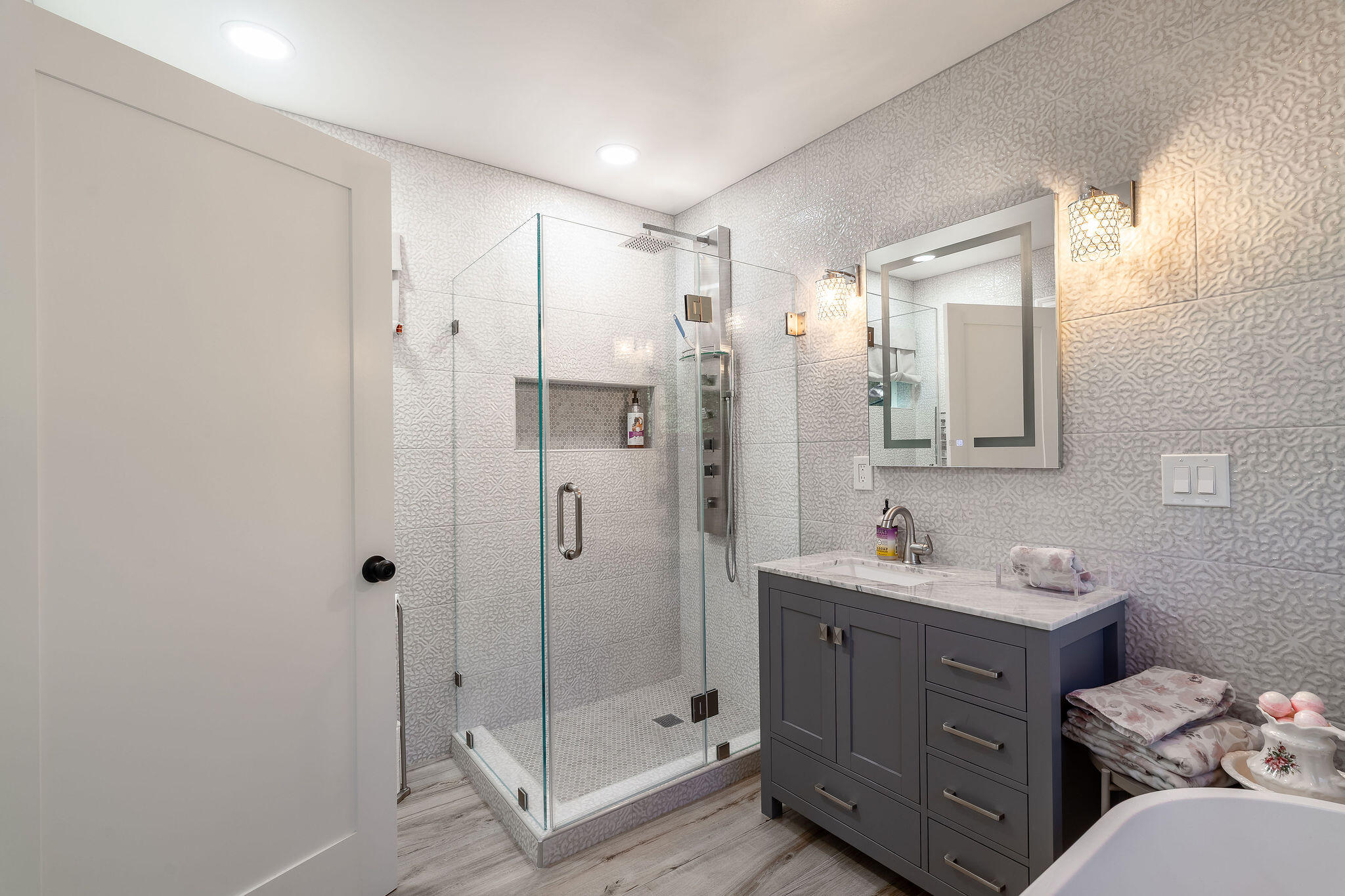 55599 Encino Road Idyllwild, CA 92549 - Photo 45 of 66 a bathroom with a double vanity sink mirror and shower