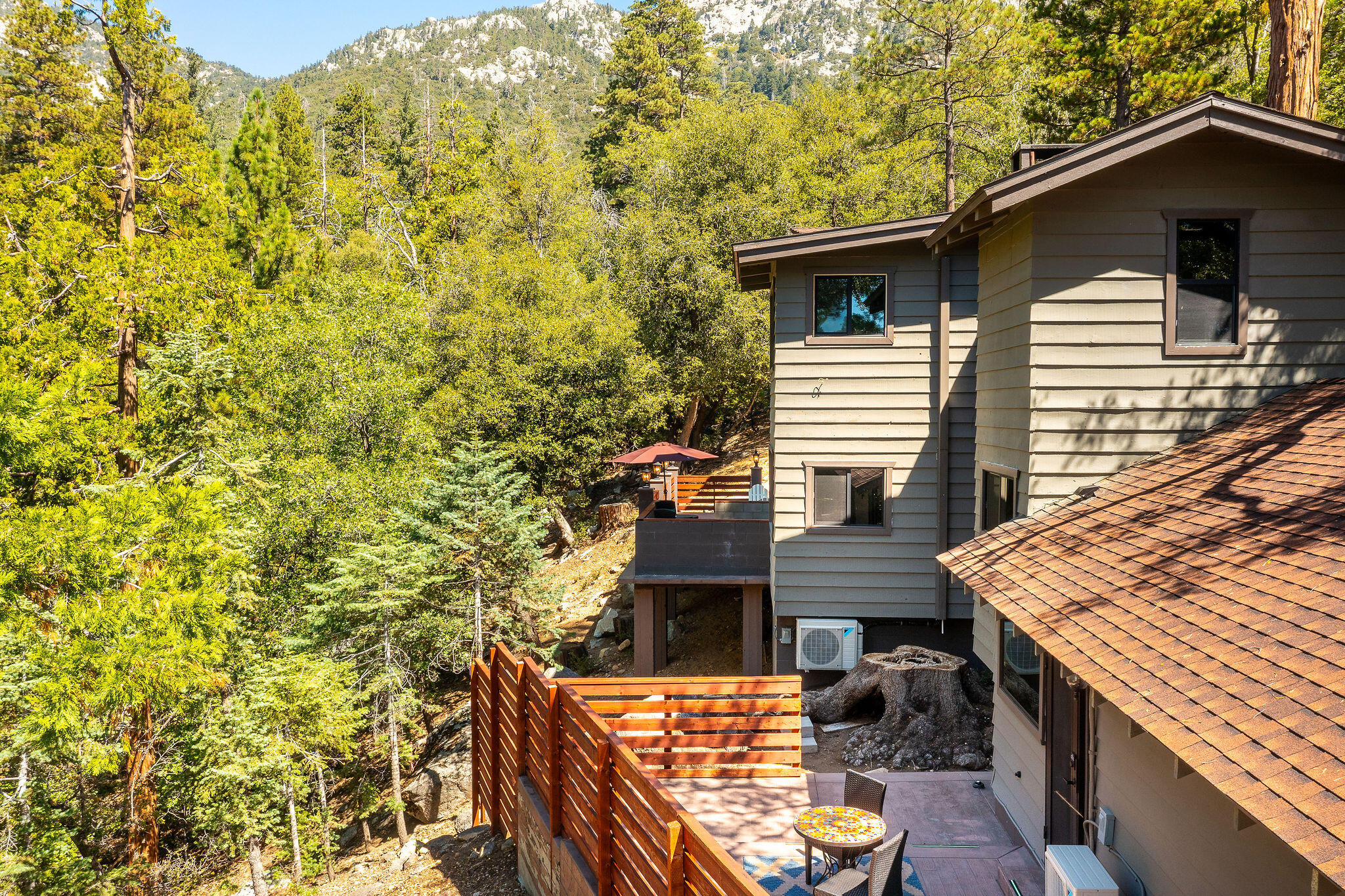 55599 Encino Road Idyllwild, CA 92549 - Photo 66 of 66 a view of a roof deck with couches and wooden floor