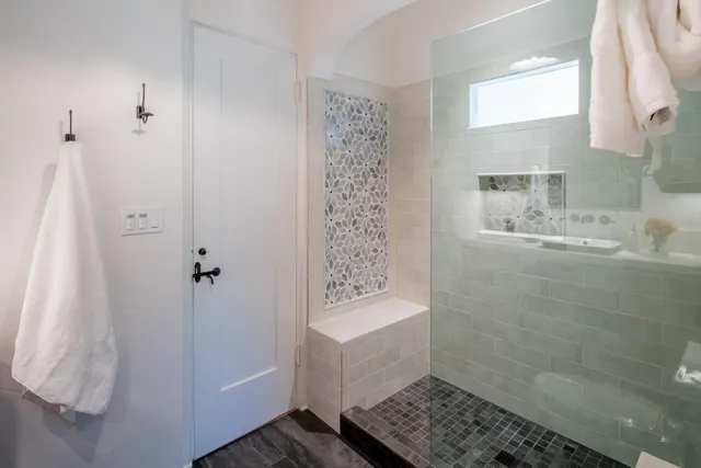 a bathroom with a bathtub and shower