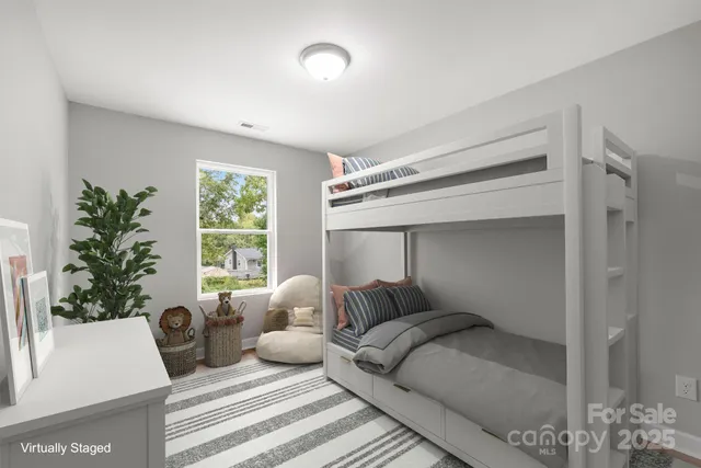 a bedroom with a bed and a potted plant