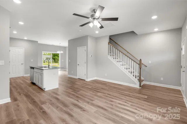 a view of an entryway with wooden floor