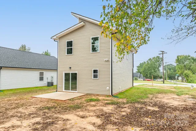 a view of a house with a yard and garage