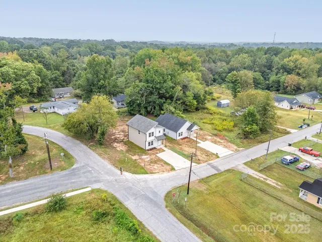 a view of a swimming pool with a yard