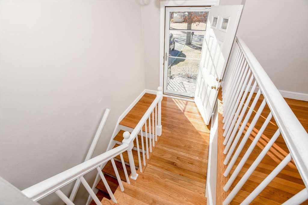 15 Zora Road Marion, MA 02738 - Photo 11 of 42 a view of staircase with wooden floor and white walls