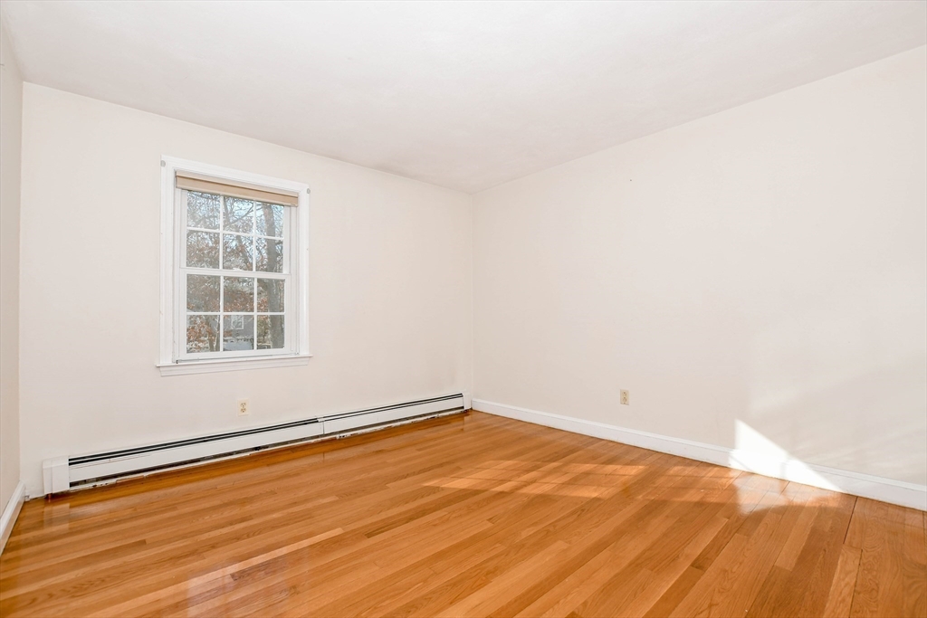 15 Zora Road Marion, MA 02738 - Photo 26 of 42 an empty room with wooden floor and windows