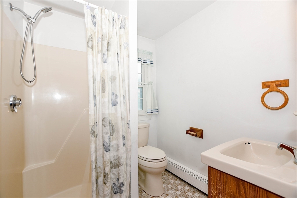 15 Zora Road Marion, MA 02738 - Photo 32 of 42 a bathroom with a sink a toilet and shower