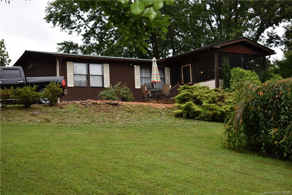 463 Lindsey Loop Road Fletcher, NC 28732 - Photo 1 of 27 a front view of a house with garden