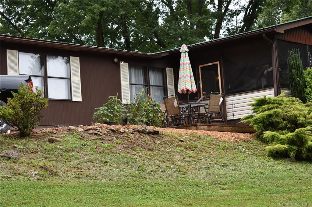 463 Lindsey Loop Road Fletcher, NC 28732 - Photo 2 of 27 a front view of a house with garden