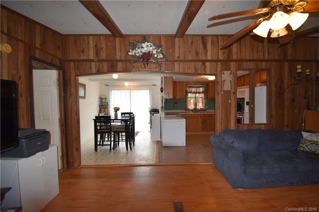 463 Lindsey Loop Road Fletcher, NC 28732 - Photo 12 of 27 a view of a living room and chandelier with furniture