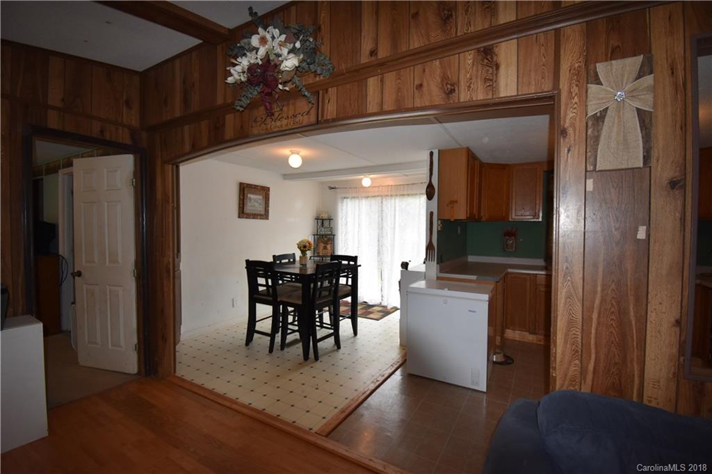 463 Lindsey Loop Road Fletcher, NC 28732 - Photo 13 of 27 a view of a dining room with furniture and a chandelier
