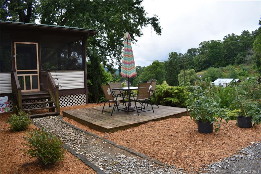 463 Lindsey Loop Road Fletcher, NC 28732 - Photo 3 of 27 a view of a chair and tables in the patio