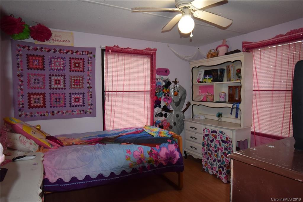 463 Lindsey Loop Road Fletcher, NC 28732 - Photo 25 of 27 a bed room with a bed and a window
