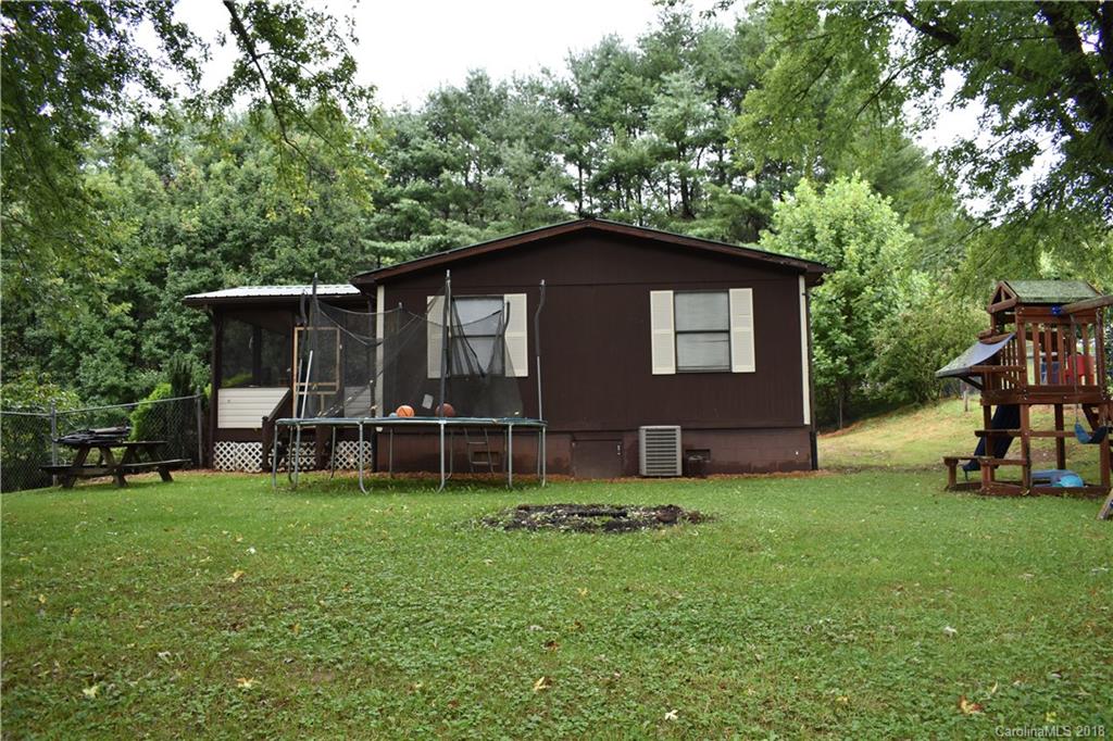 463 Lindsey Loop Road Fletcher, NC 28732 - Photo 4 of 27 a backyard of a house with table and chairs