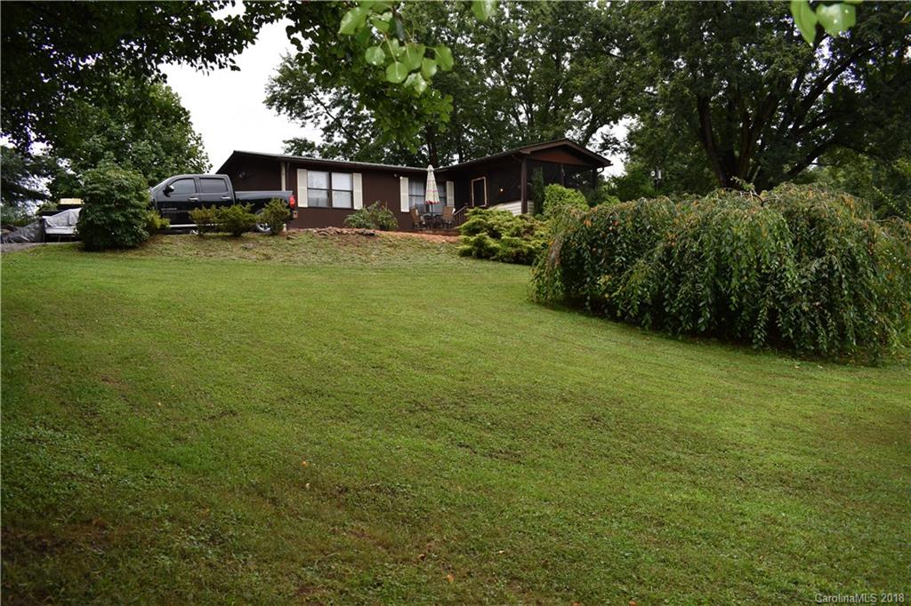 463 Lindsey Loop Road Fletcher, NC 28732 - Photo 9 of 27 a house view with a garden space