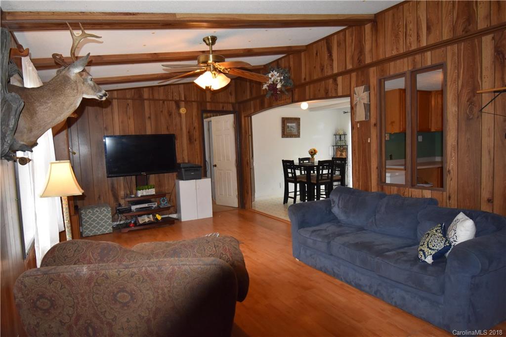 463 Lindsey Loop Road Fletcher, NC 28732 - Photo 10 of 27 a living room with furniture and a flat screen tv