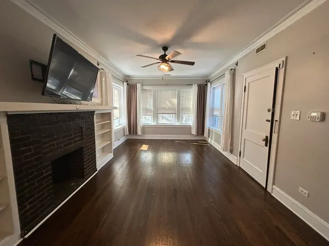 a view of livingroom with hardwood floor and a ceiling fan