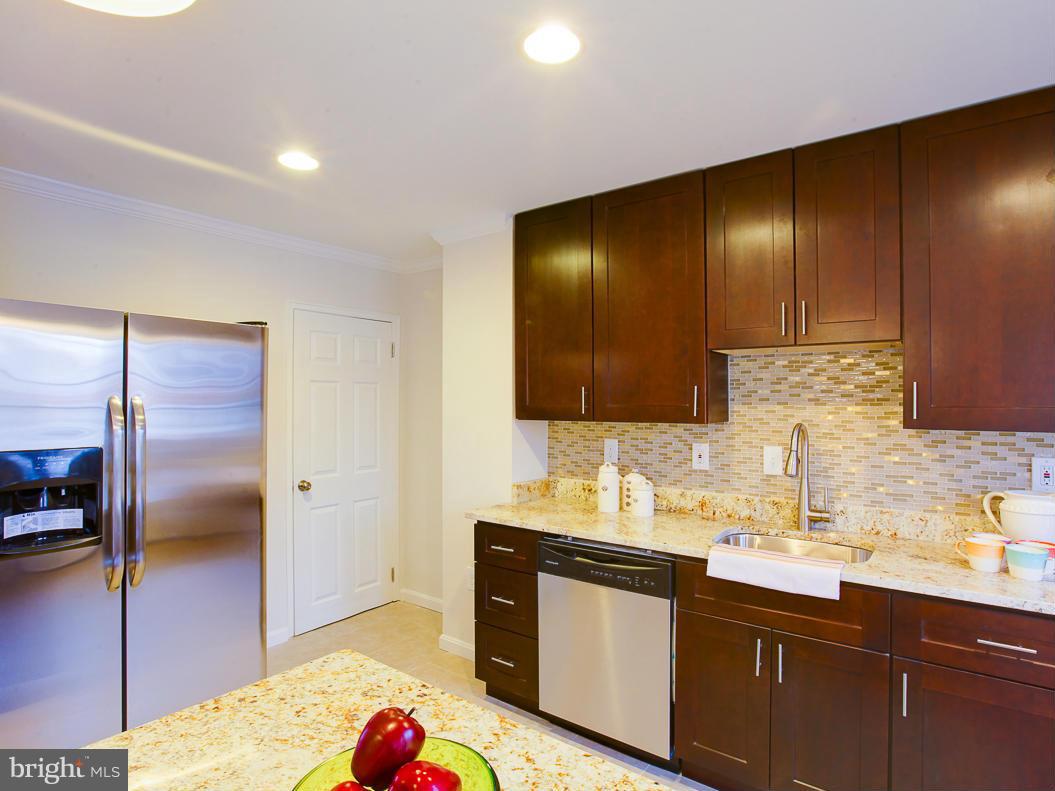 1927 Northbourne Road Baltimore, MD 21239 - Photo 4 of 30 a kitchen with a sink and a refrigerator