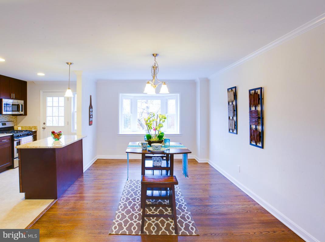 1927 Northbourne Road Baltimore, MD 21239 - Photo 8 of 30 a living room with furniture dining table a window and appliances