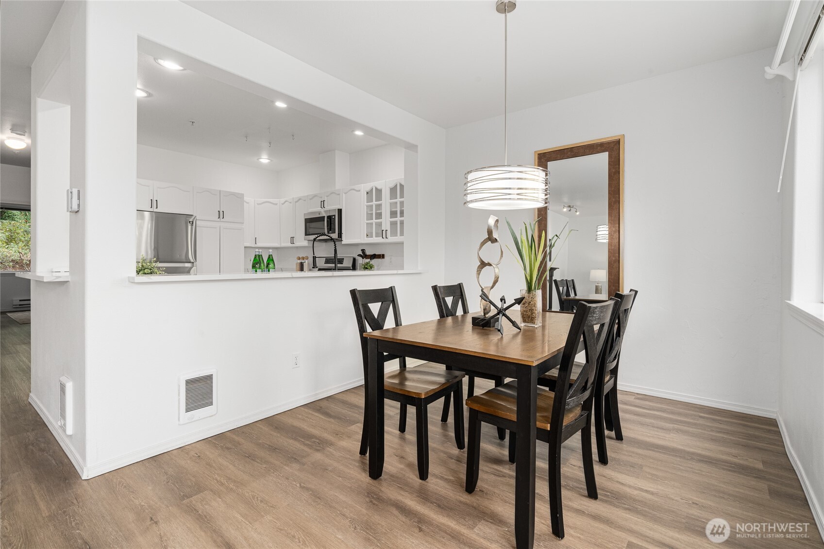 7583 Old Redmond Road, Unit A203 Redmond, WA 98052 - Photo 11 of 29 a view of a dining room with furniture and wooden floor