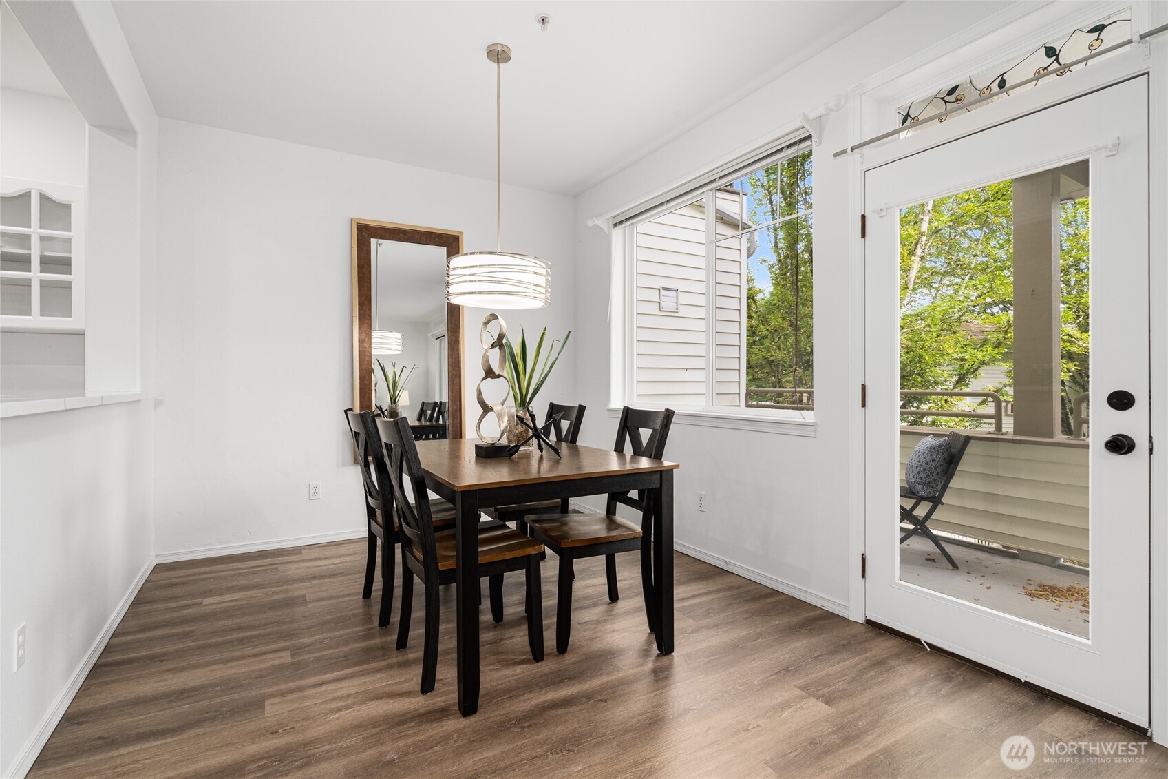 7583 Old Redmond Road, Unit A203 Redmond, WA 98052 - Photo 12 of 29 a view of a dining room with furniture window and wooden floor