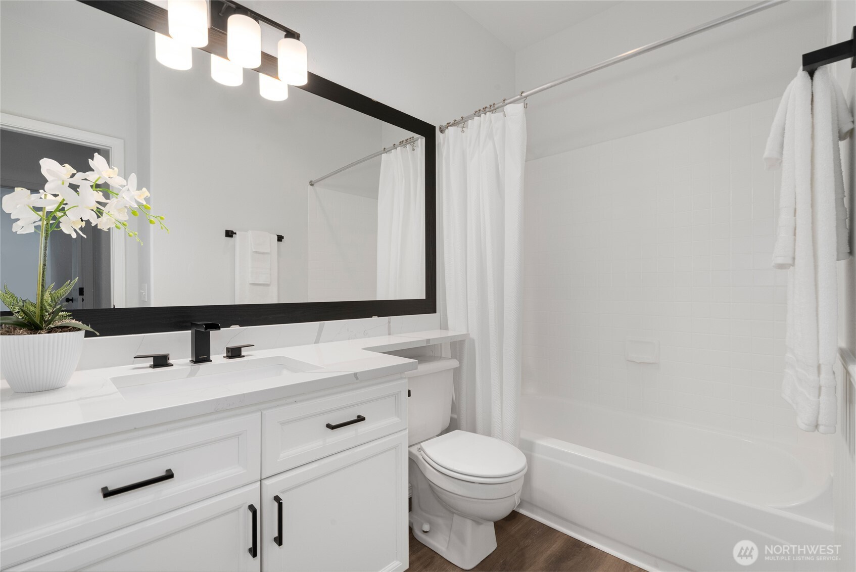 7583 Old Redmond Road, Unit A203 Redmond, WA 98052 - Photo 15 of 29 a bathroom with a sink a toilet a mirror and shower