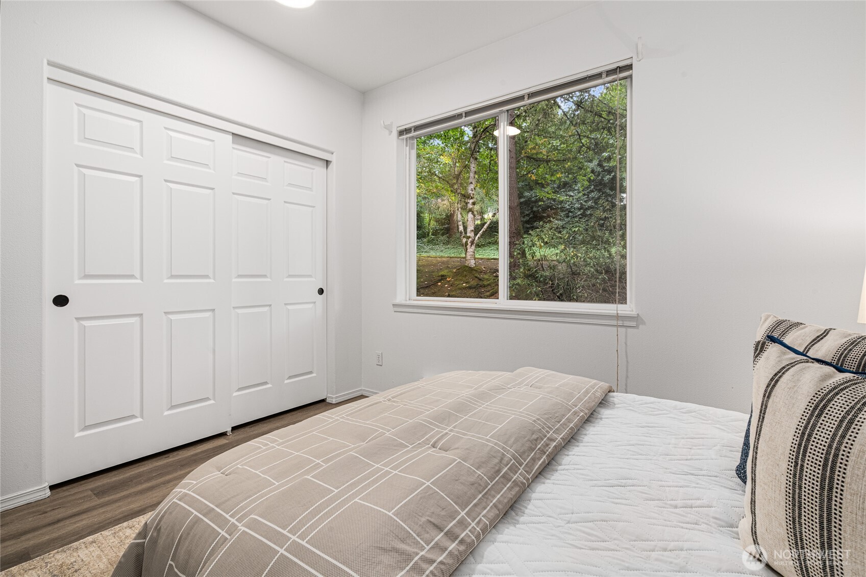 7583 Old Redmond Road, Unit A203 Redmond, WA 98052 - Photo 22 of 29 a bedroom with a bed and a window