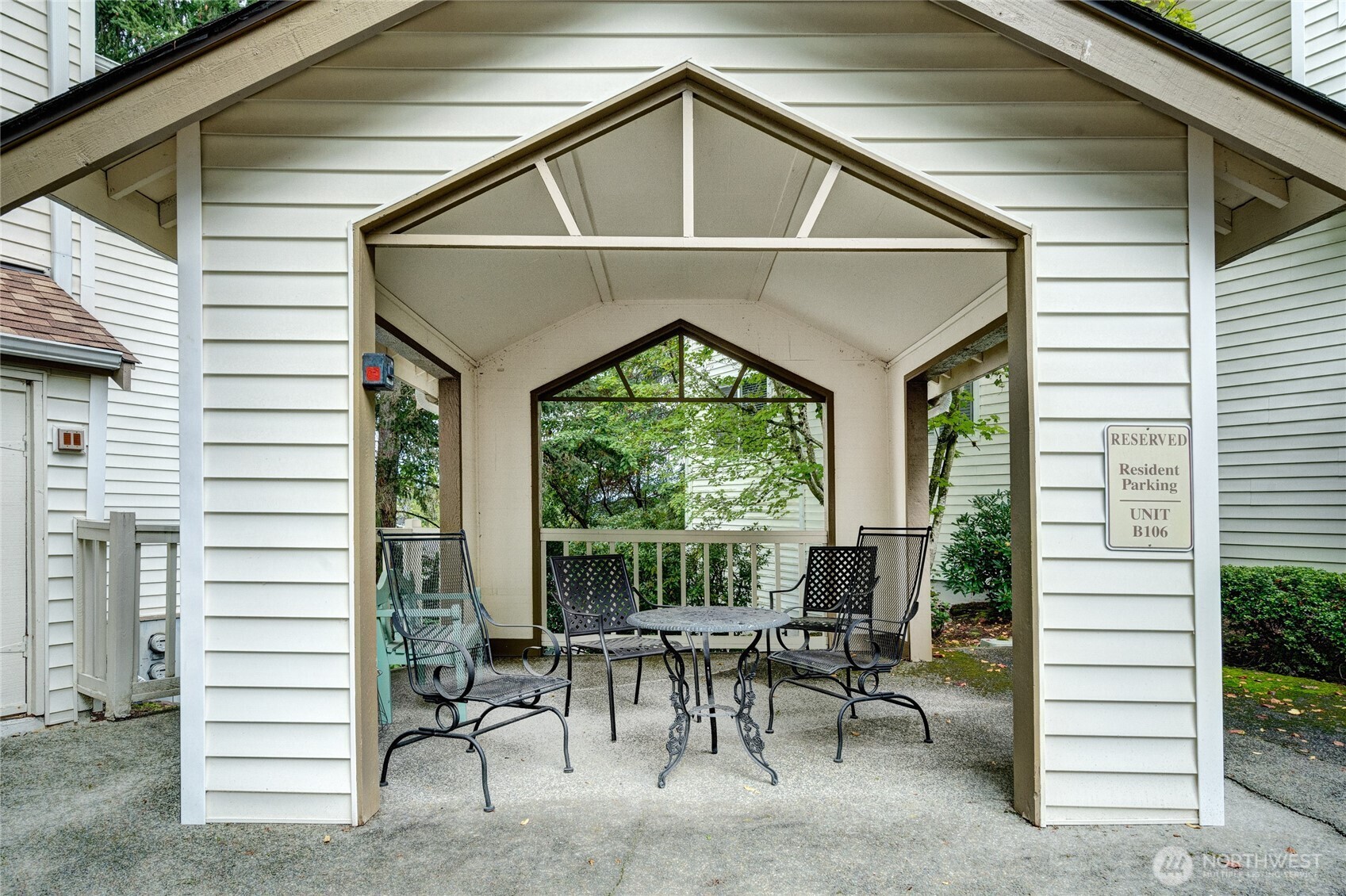 7583 Old Redmond Road, Unit A203 Redmond, WA 98052 - Photo 29 of 29 a view of a patio with table and chairs and floor to ceiling window