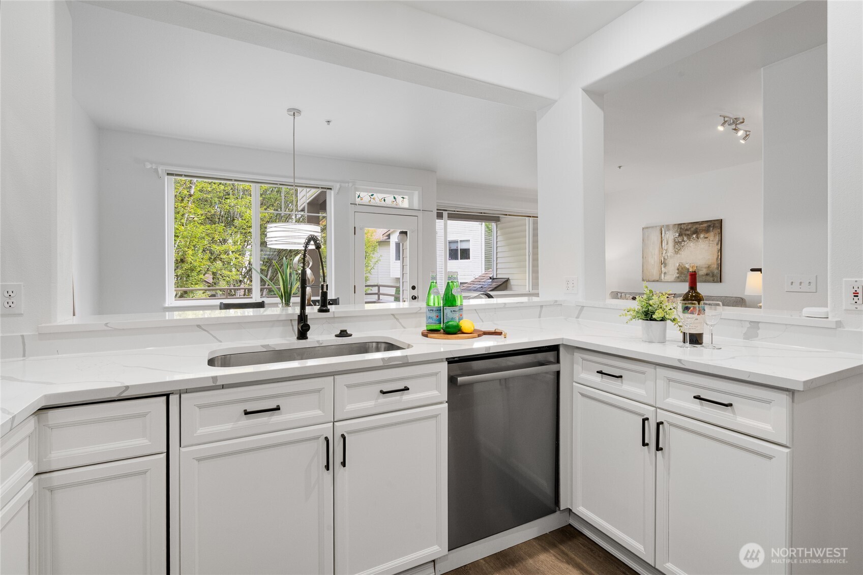 7583 Old Redmond Road, Unit A203 Redmond, WA 98052 - Photo 8 of 29 a kitchen with white cabinets and white appliances